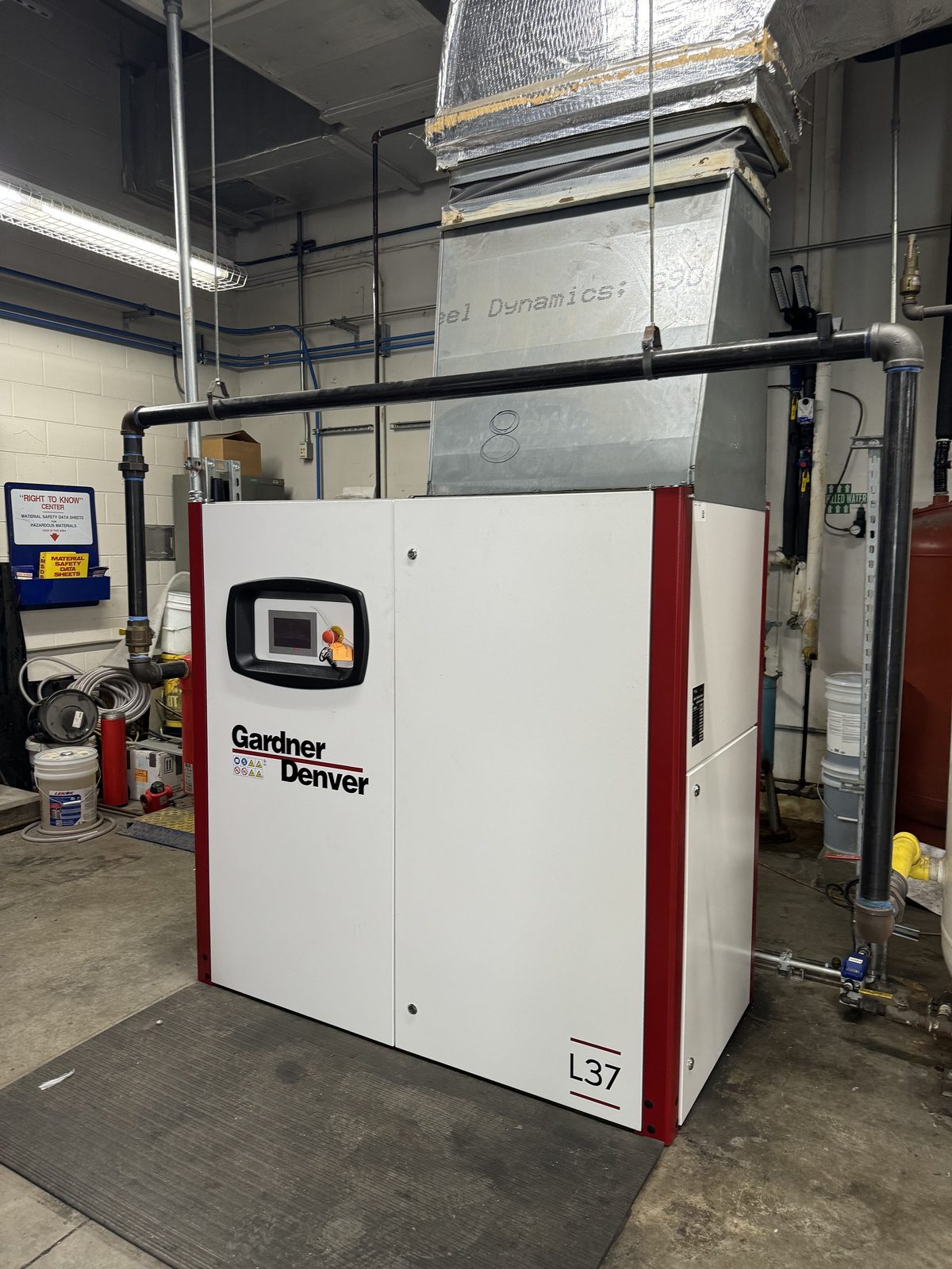 Gardner Denver L37 rotary screw compressor being serviced in a plant