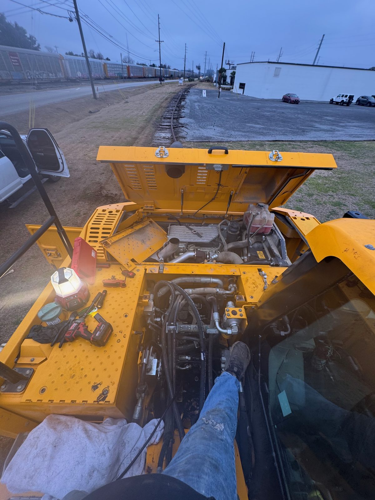 Hydraulic service on an articulated hauler in the field