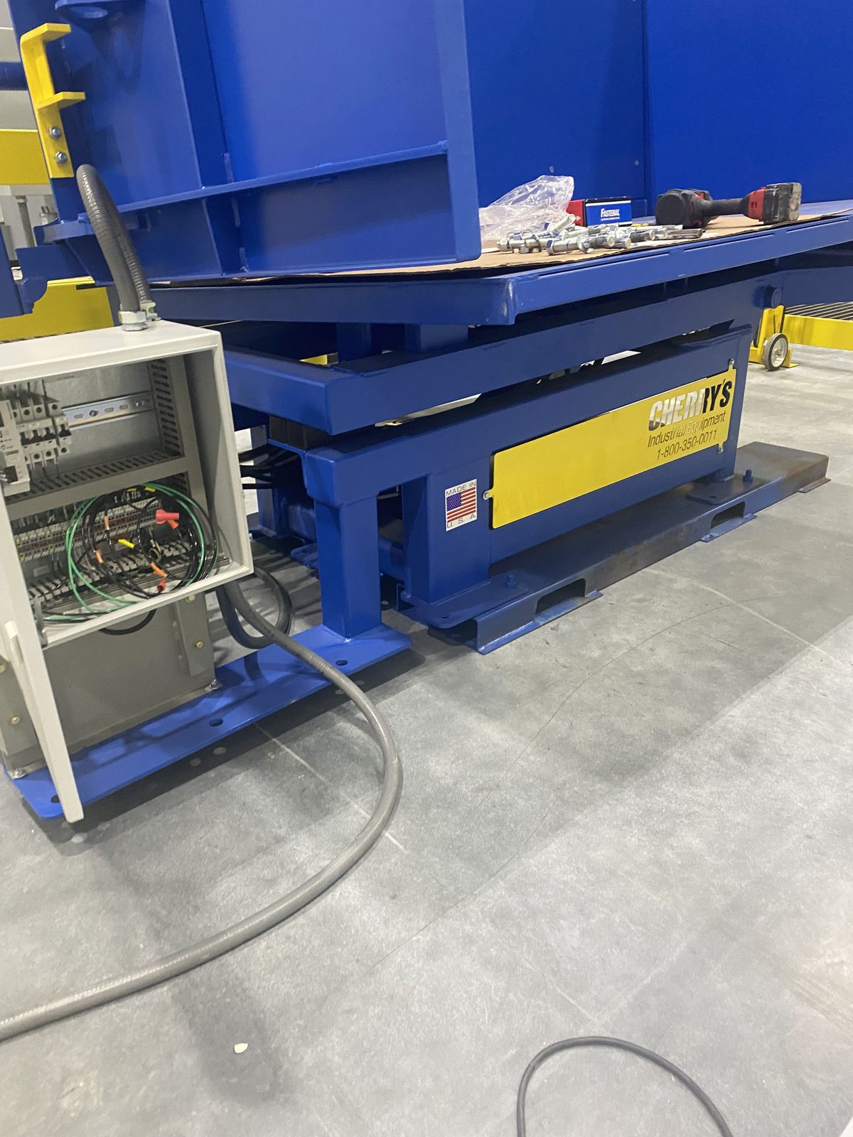 Industrial equipment installation with electrical panel connection